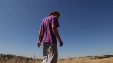 Man doing back flip in the field