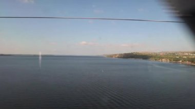 view from the train window on the river