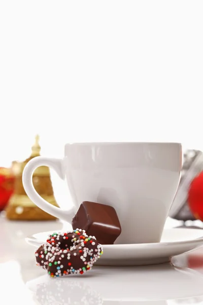 Kaffeetasse und Bonbons — Stockfoto