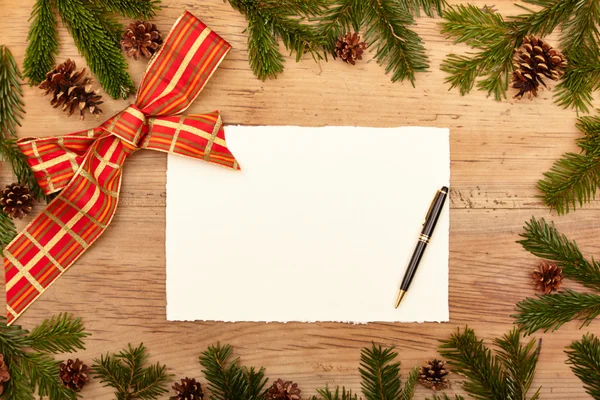 Blank card,  pen, fir twigs and ribbon — Stock Photo, Image