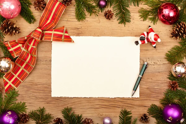 Blank card, pen, fir twigs and ribbon — Stock Photo, Image