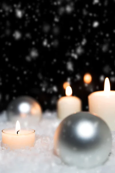 Silver baubles and white candles — Stock Photo, Image