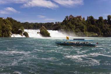 Switzerland,Neuhausen,View of rhine waterfall with tourist trave clipart