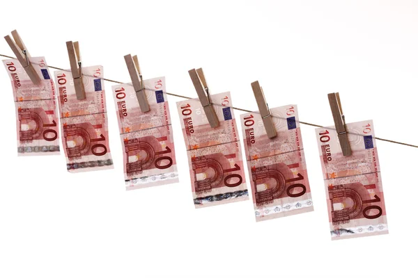 10 Euro bank notes hanging on clothesline — Stock Photo, Image