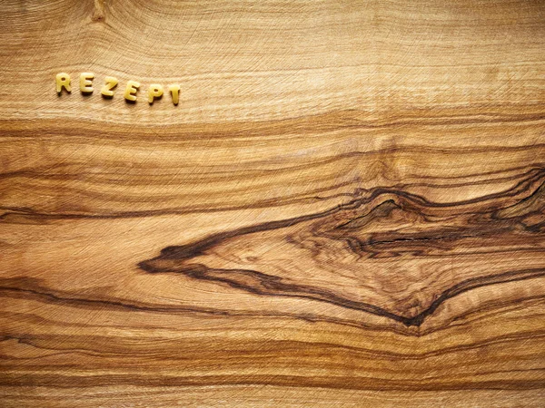 Alfabet noedels op hout, recept — Stockfoto