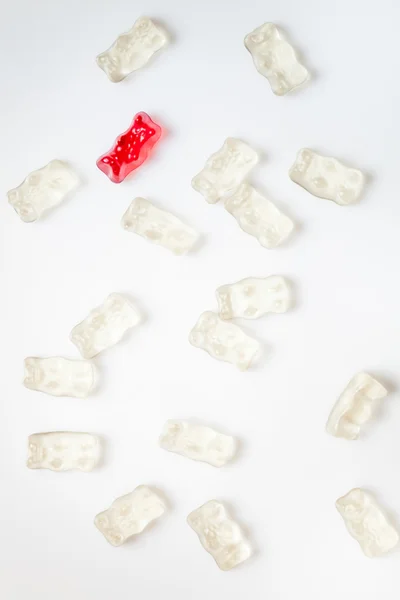 White gummy bear, surrounded by whithe gummy bears