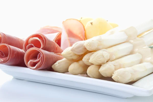 Asparagus,potatoes and parma ham in plate on white background — Stock Photo, Image