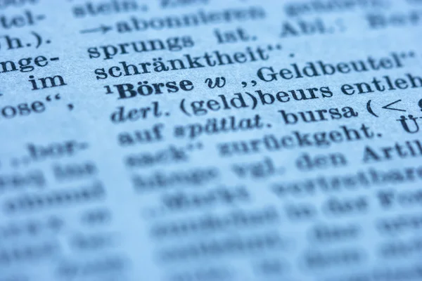 Extrem närbild på börsen dictionary i tidningen — Stockfoto