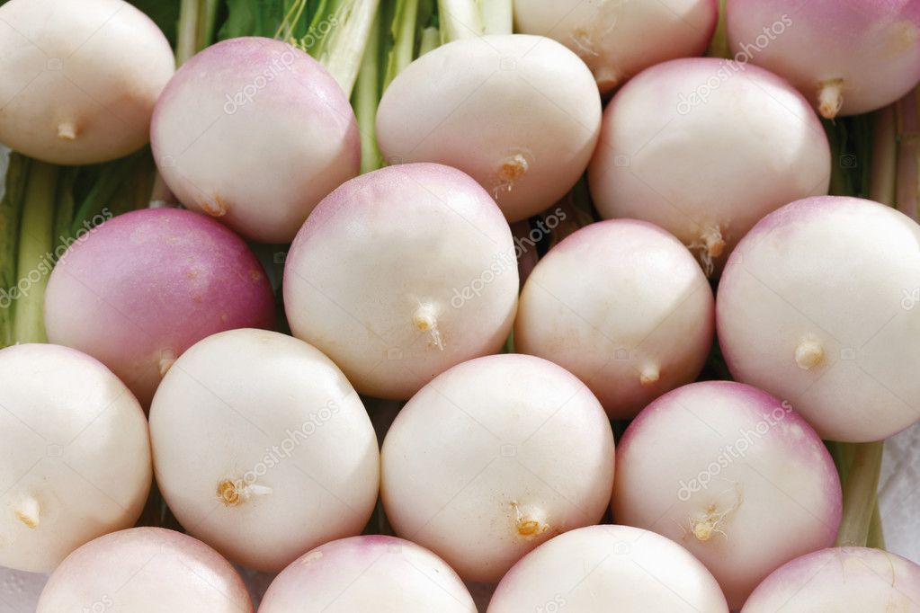 Stacked white baby turnips