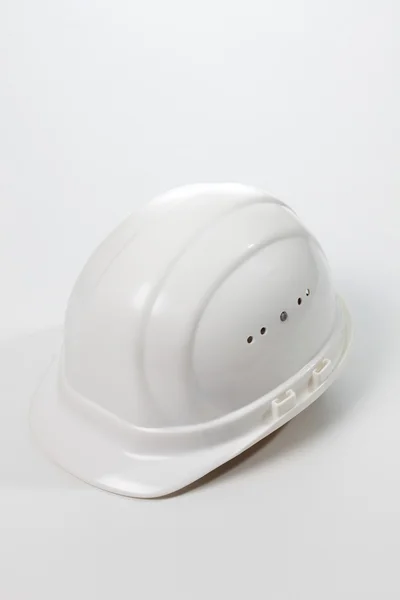 白い背景に白いヘルメット — ストック写真