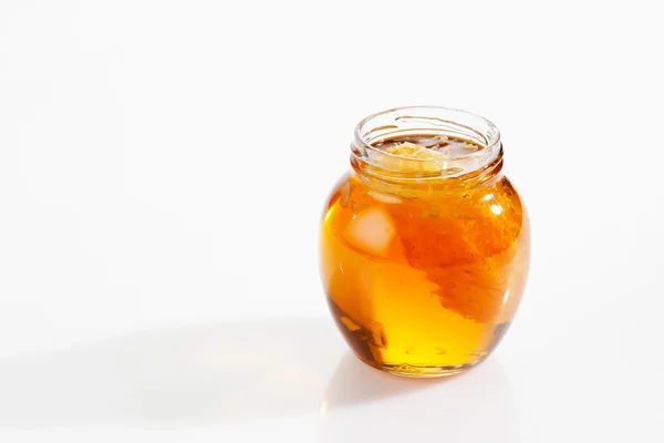 Glass with blossom honey and honeycomb — Stock Photo, Image