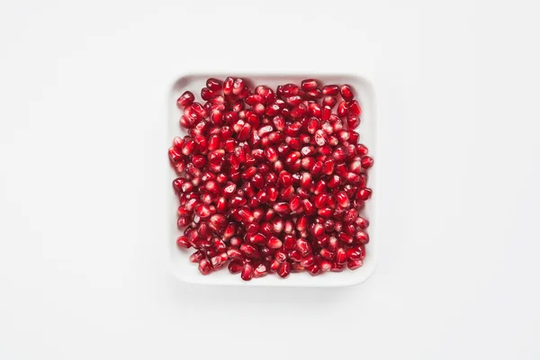 Pomegranate seeds in bowl — Stock Photo, Image