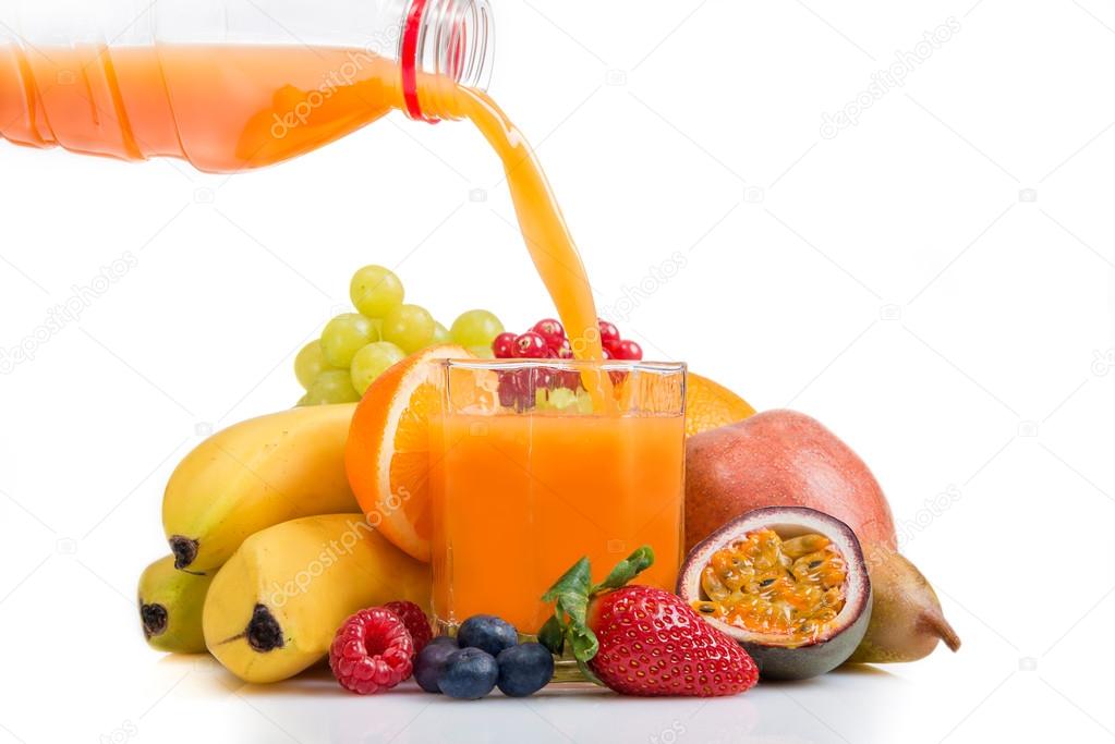 Multi vitamine fruit juice being poured from bottle