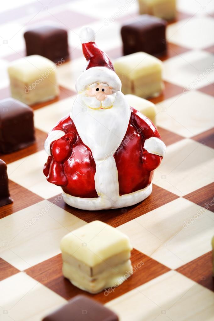 Dominostein Christmas pastry  with chocolate icing on chess boar