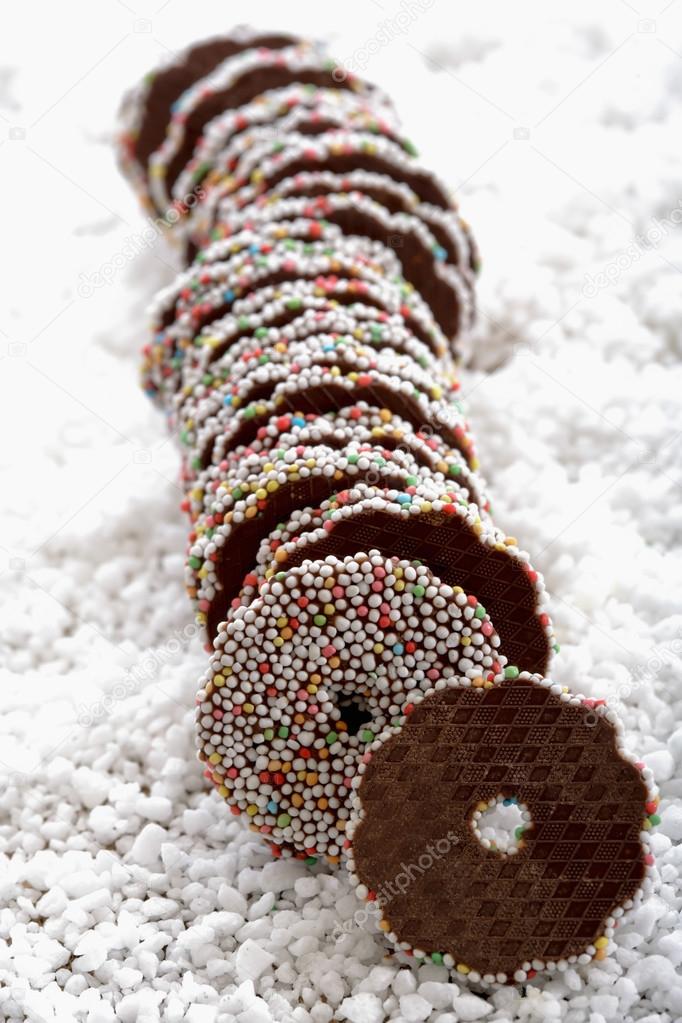 Chocolate fondant rings on icing sugar