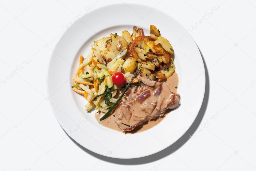 Saddle of pork steak with chipped potatoes and julienne vegegeta