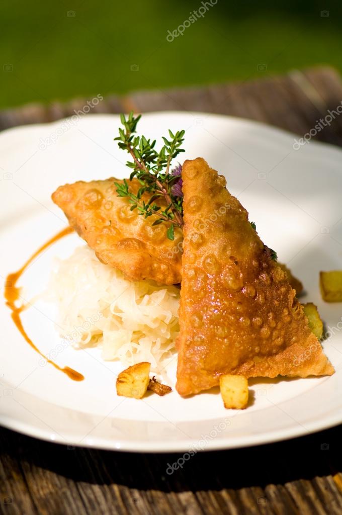 Typical Austrian meal, Fleischkrapfen with pickled cabbage and p