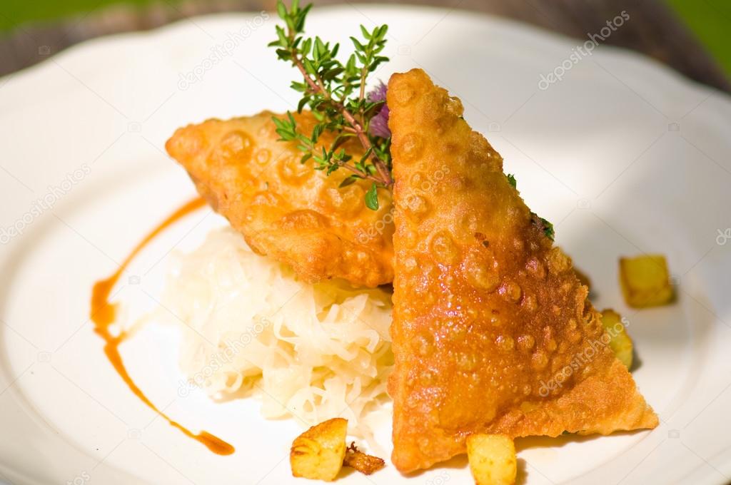 Typical Austrian meal, Fleischkrapfen with  pickled cabbage and 
