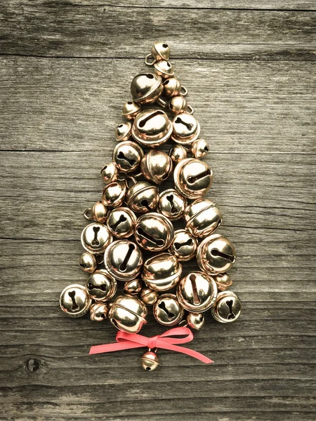 Bells, christmas tree on wood — Stock Photo, Image