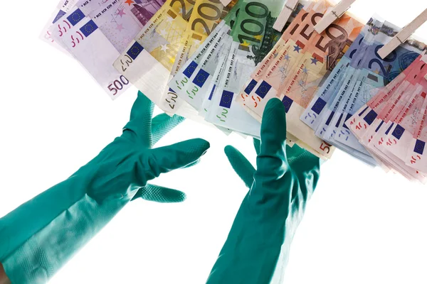 Person reaching for Euro notes on clothesline, close-up Stock Image