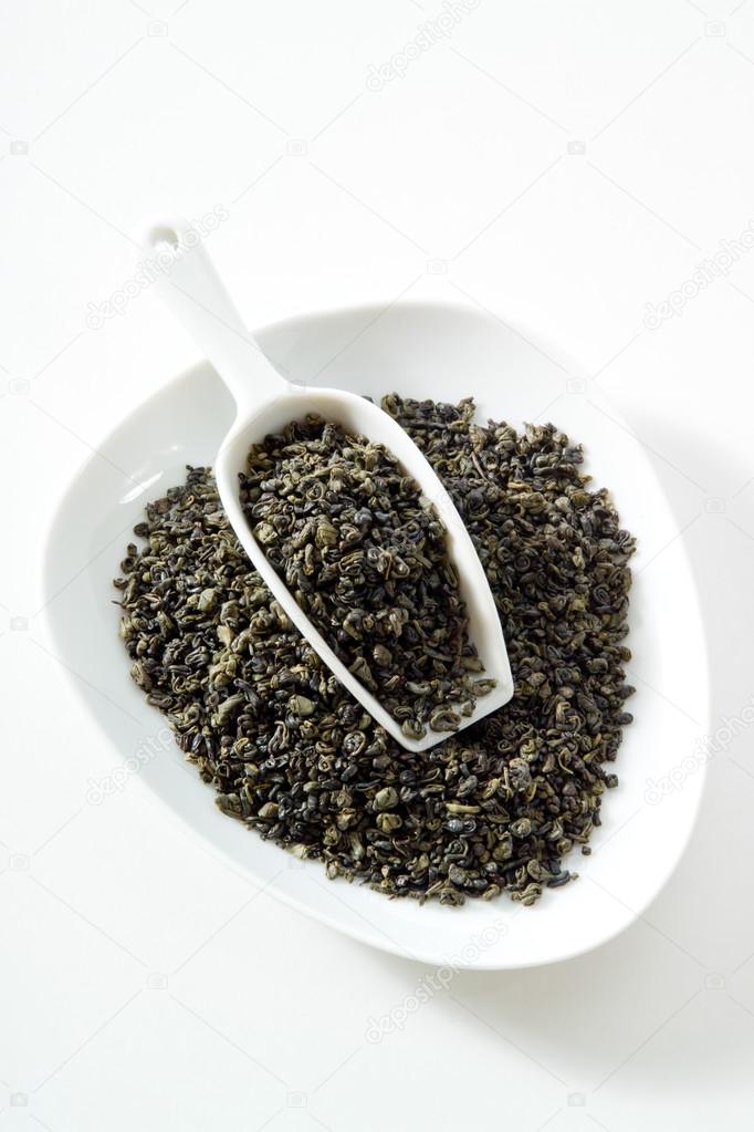 Green tea, gunpowder tea, bowl, white background