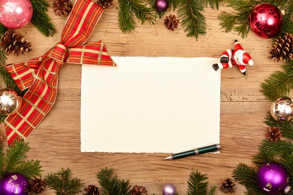 Blank card, ballpen, fir twigs and ribbon, on wood — Stock Photo, Image