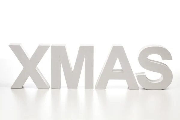 Letras maiúsculas formando a palavra xmas — Fotografia de Stock