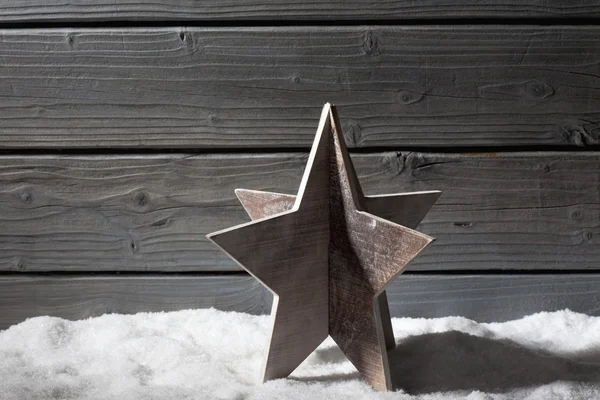 Star decoration on pile of snow — Stock Photo, Image