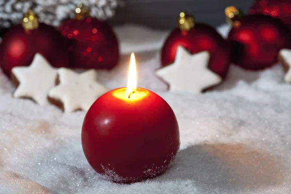 Christmas bulbs and candle — Stock Photo, Image