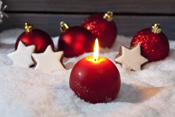 Christmas bulbs on pile of snow — Stock Photo, Image