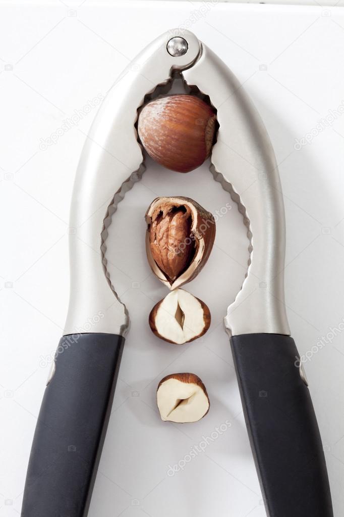 Hazelnuts and metal nutcracker
