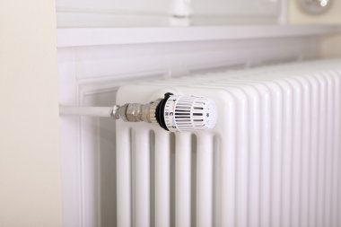 White radiator with thermostat clipart