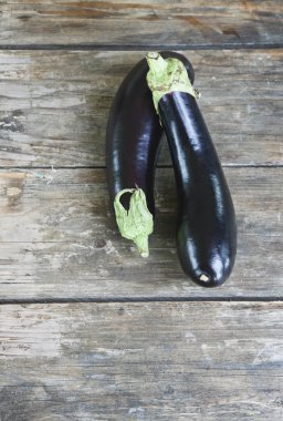 Italy, Tuscany, Magliano, Aubergines on wooden table