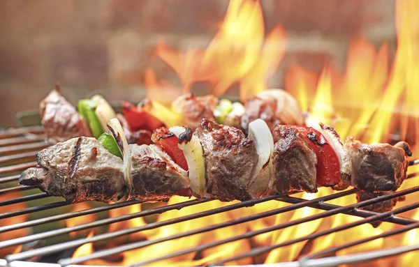 Shish kebabs on grill — Stock Photo, Image