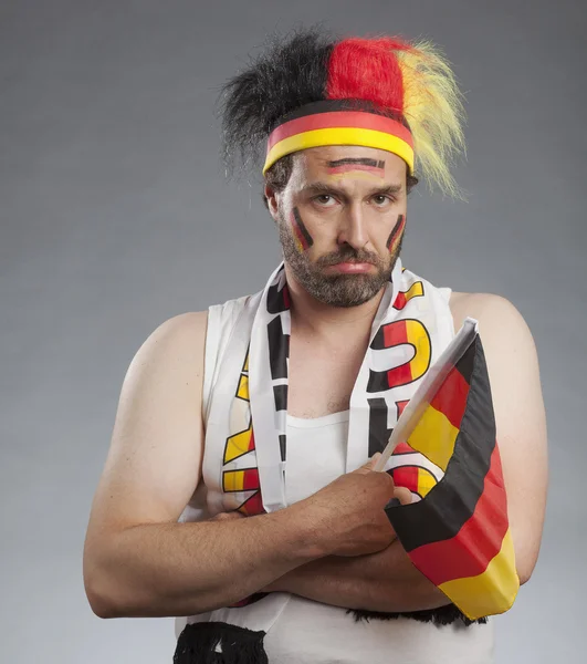 Sad german soccer fan sitting with hands folded — Stock Photo, Image