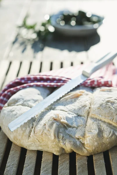 Italy, Tuscany, Magliano, Close up of bread and knife — Stock fotografie