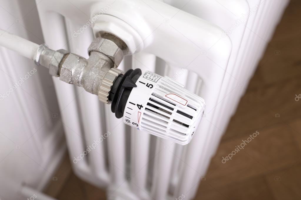 White radiator with thermostat