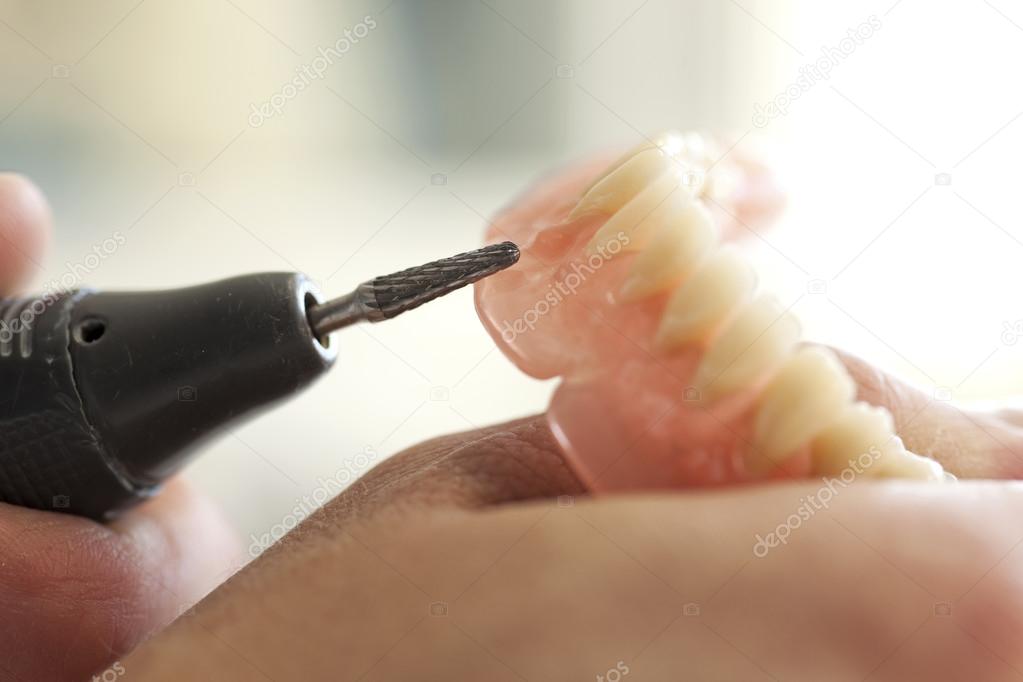 Dental technician working in dental laboratory — Stock Photo