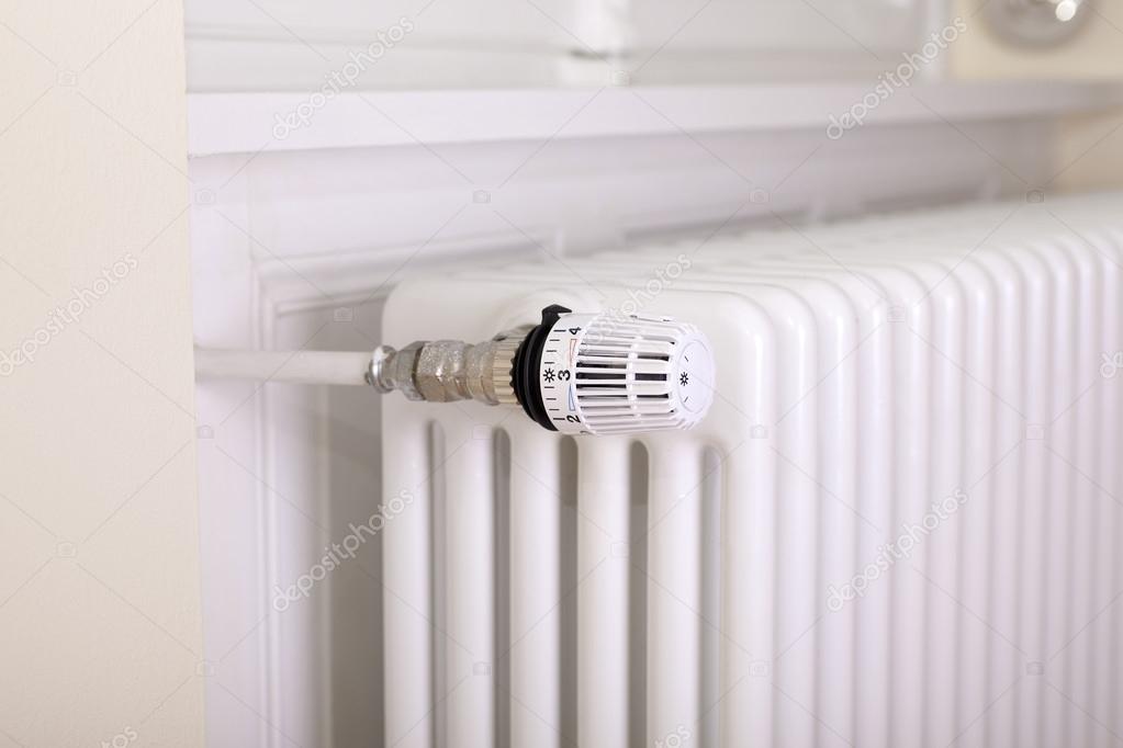 White radiator with thermostat