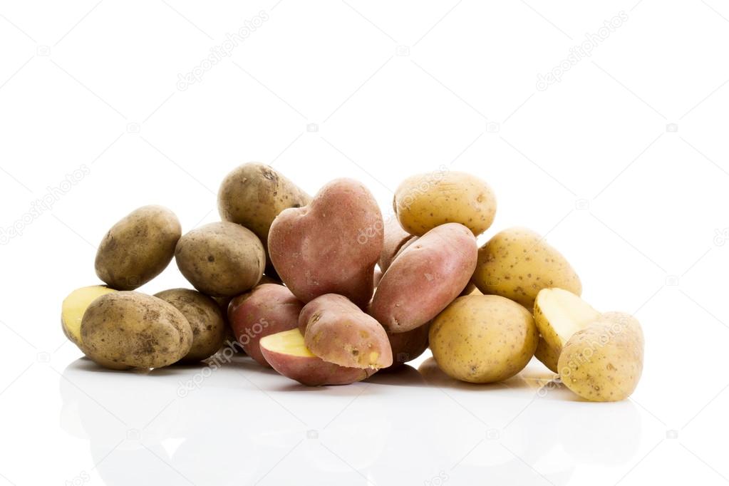 Different types of potatoes on white background