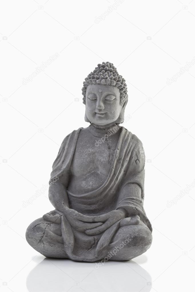Buddha statue on white background, close up