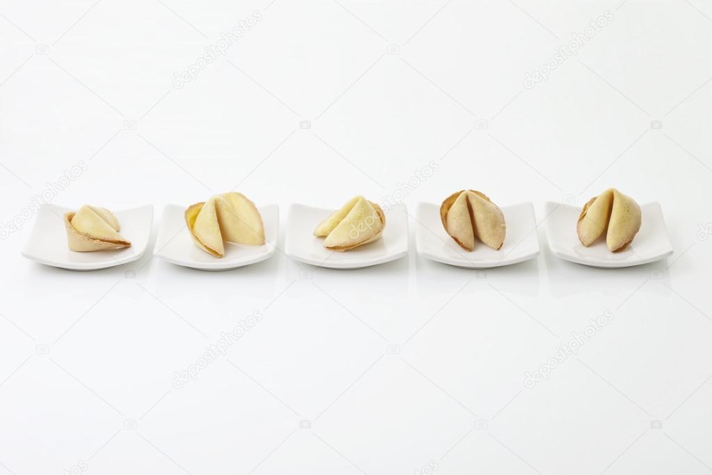 Fortune cookies in square plate on white background