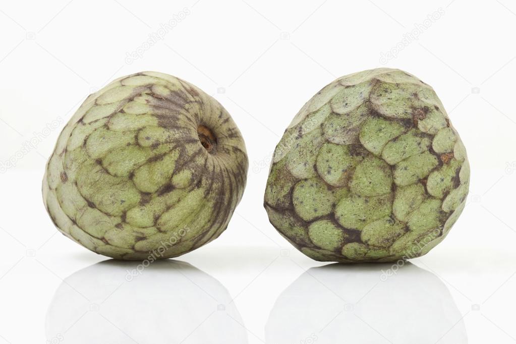Two cherimoya on white background Stock Photo by ©TunedIn61 85072746