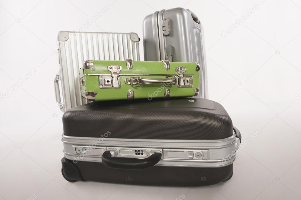 Variety of suitcases and luggage on white background