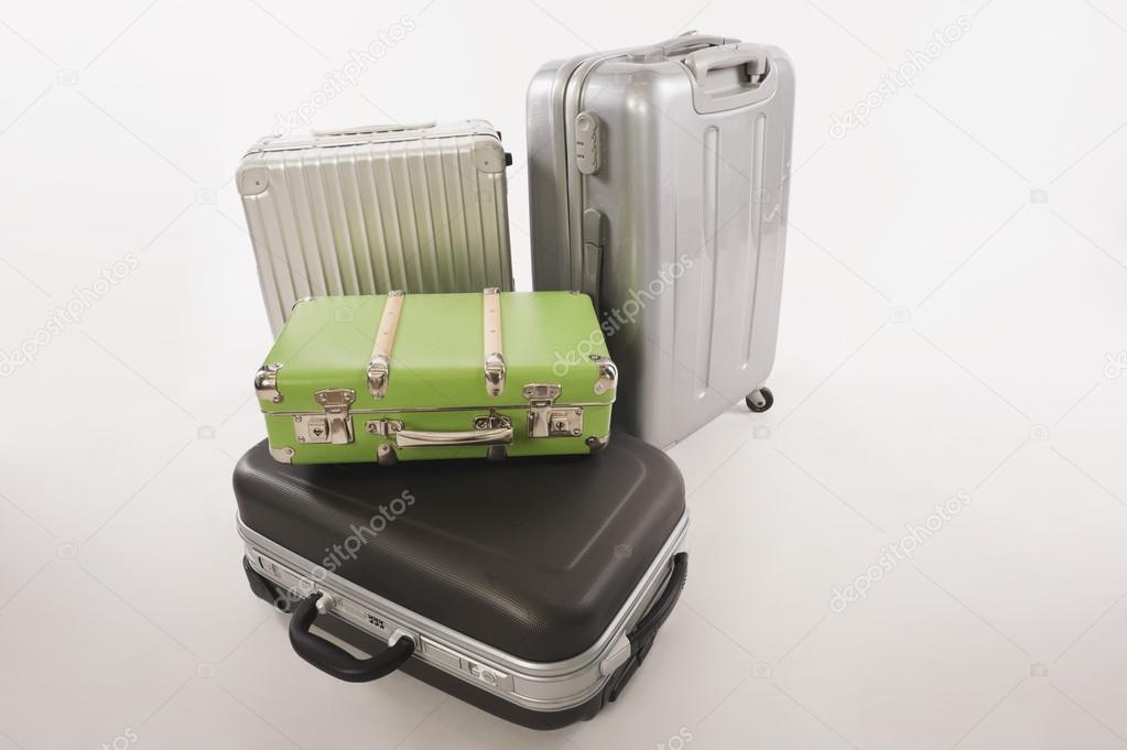 Variety of suitcases and luggage on white background