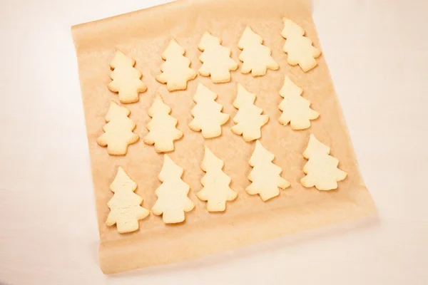 Baking paper, cookies, fir tree shape — Stock Photo, Image