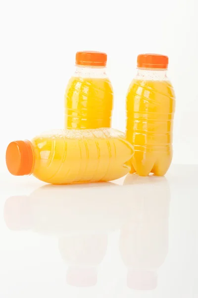 Orange juice bottles — Stock Photo, Image