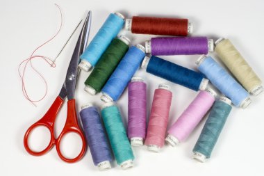 Bobbins with colorful thread clipart