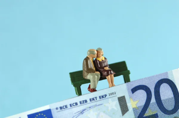 Plastfigurer på eurosedler - Stock-foto