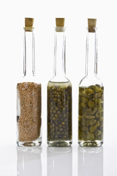 Bottles with mustard grains — Stock Photo, Image